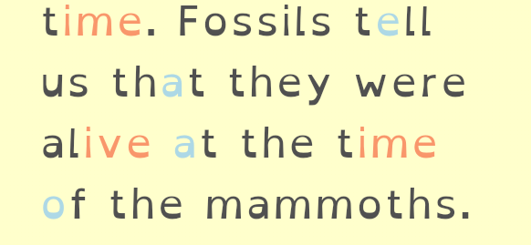 Sample text in a large spaced typeface, “time. Fossils tell us that they were alive at the time of the mammoths.”, with some letters in lighter colours.