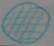 A blue circle filled with a grid of crossing lines.