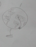 Pencil sketch of a round shape with small flower-like marks on a short stem.