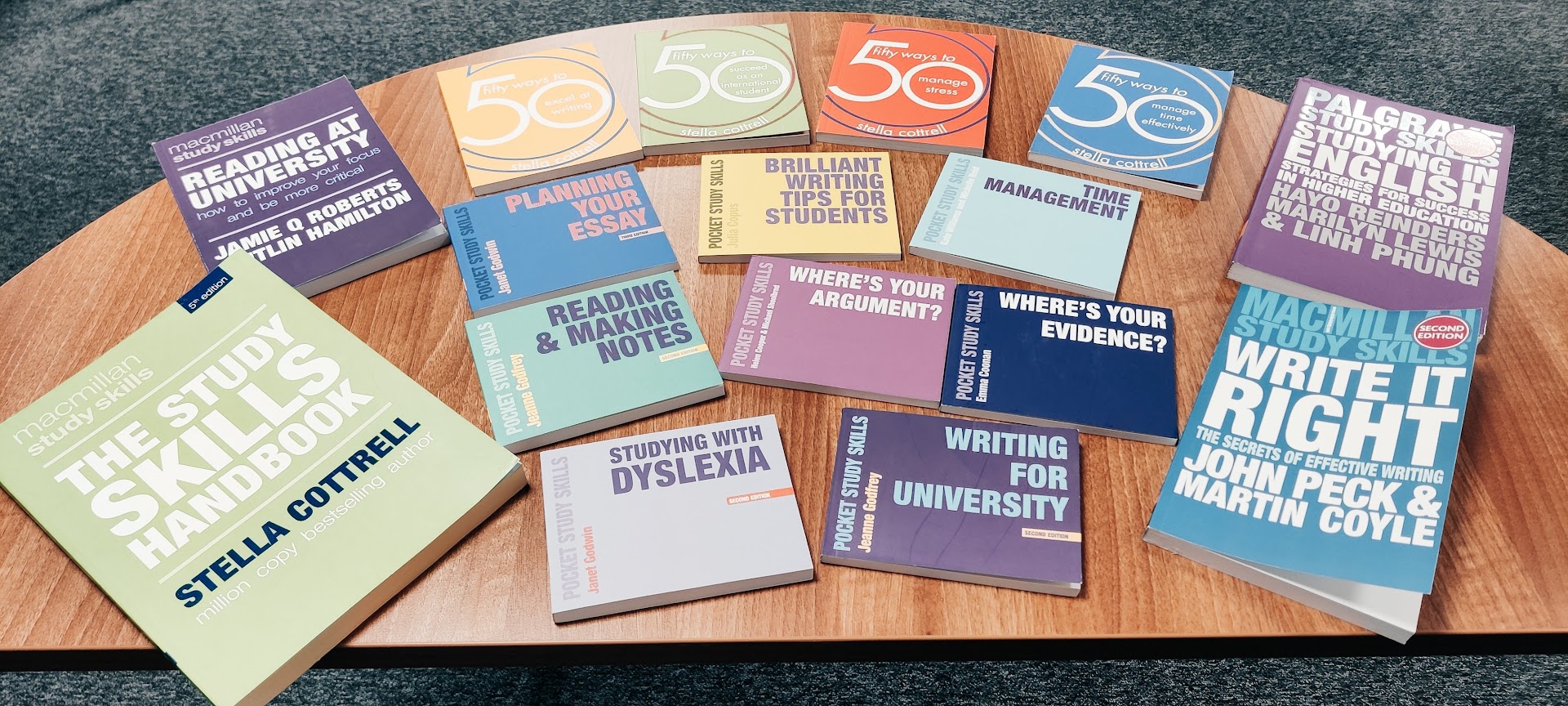 Photograph of many study-skills books spread over a table, among them Reading at University, Planning Your Essay, Reading & Making Notes, Studying with Dyslexia, Writing for University and Where’s Your Argument?