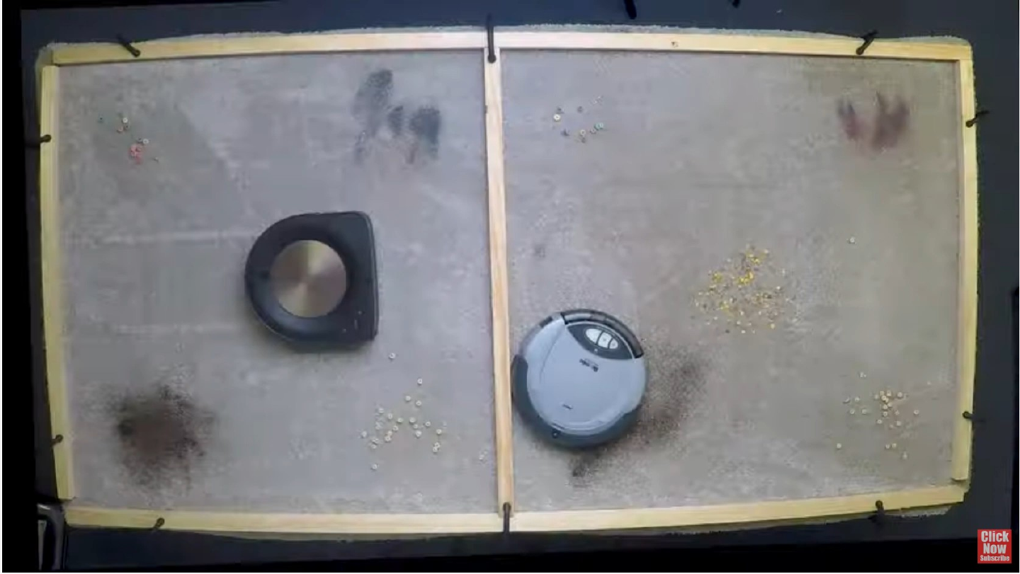 Original slide 49 as rendered: a frame of a video from above of two robot vacuum cleaners working on a table scattered with crumbs. The video itself is not part of this package.