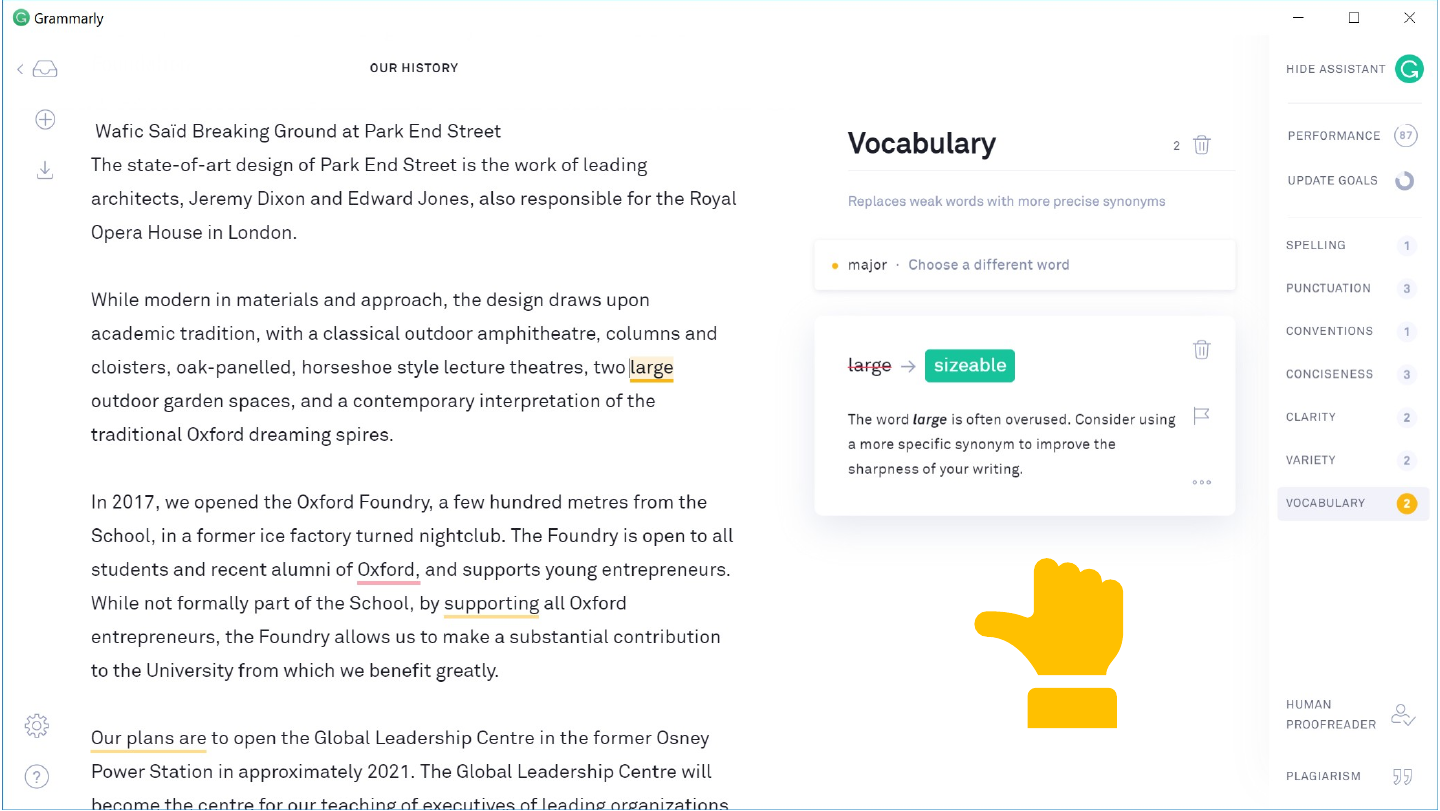 The slide's original page: a Grammarly window with the document “Our history” on the left and a “Vocabulary” panel open, suggesting “sizeable” in place of “large”. At the lower right of the page is a yellow hand icon turned sideways, its thumb pointing left, its fingers curled up and its cuff below; it is neither thumbs-up nor thumbs-down.